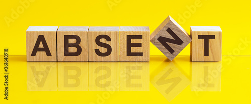 Photos ABSENT the word is written on a wooden block