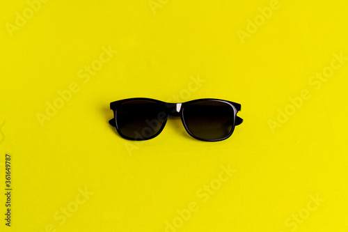 Sunglasses isolated in a yellow background