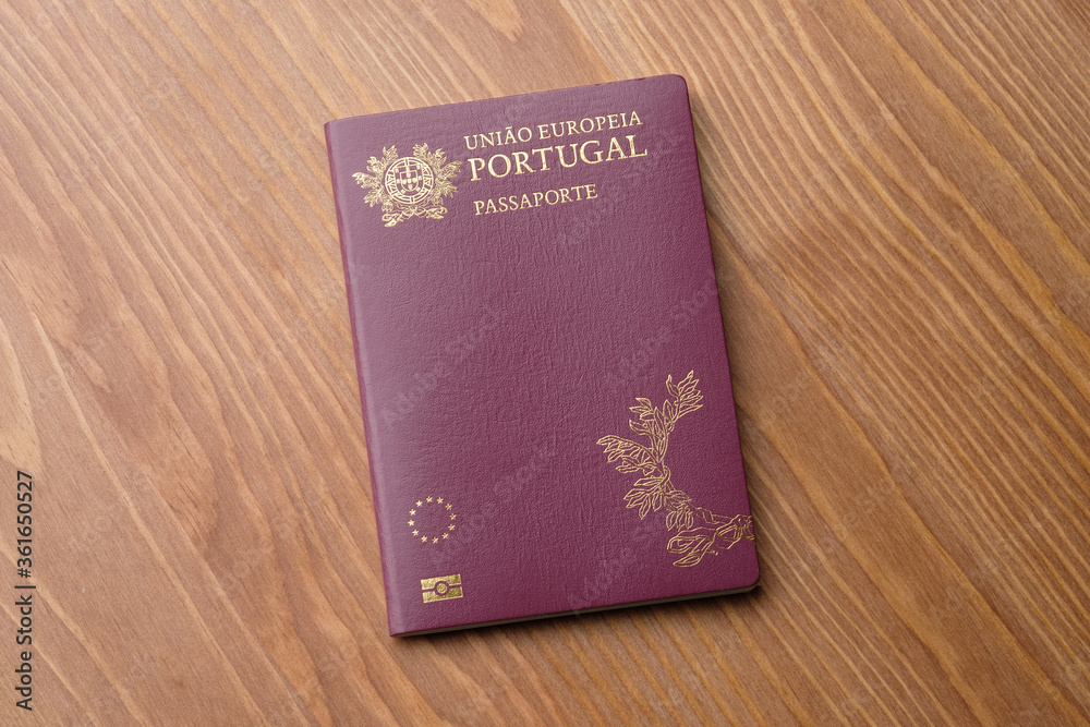 Portuguese foreign passport on table Portuguese foreign passport on table
