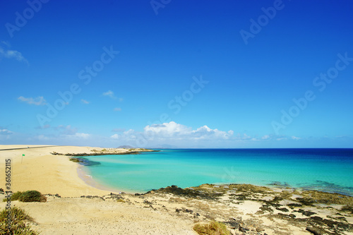 Tropical beach  azure ocean water and blue sky. Paradise landscape.