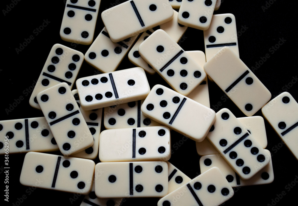 Closeup of a set of scattered domino pieces. Closeup of a set of scattered domino pieces.