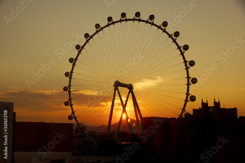 Photography Sunrise through The High Roller Wheel light up at dawn