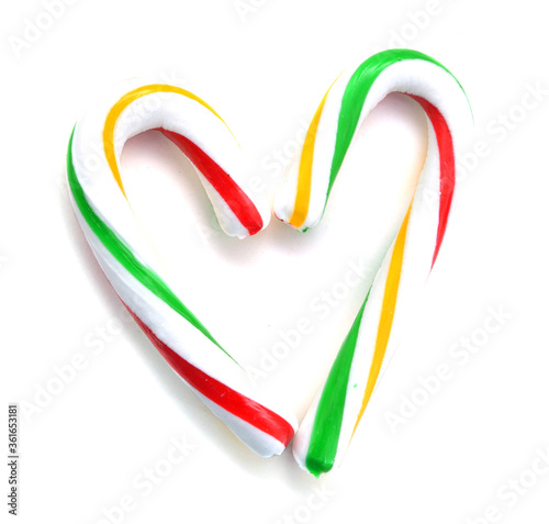 Christmas Sugar Candy Cones forming a heart and isolated on a white background