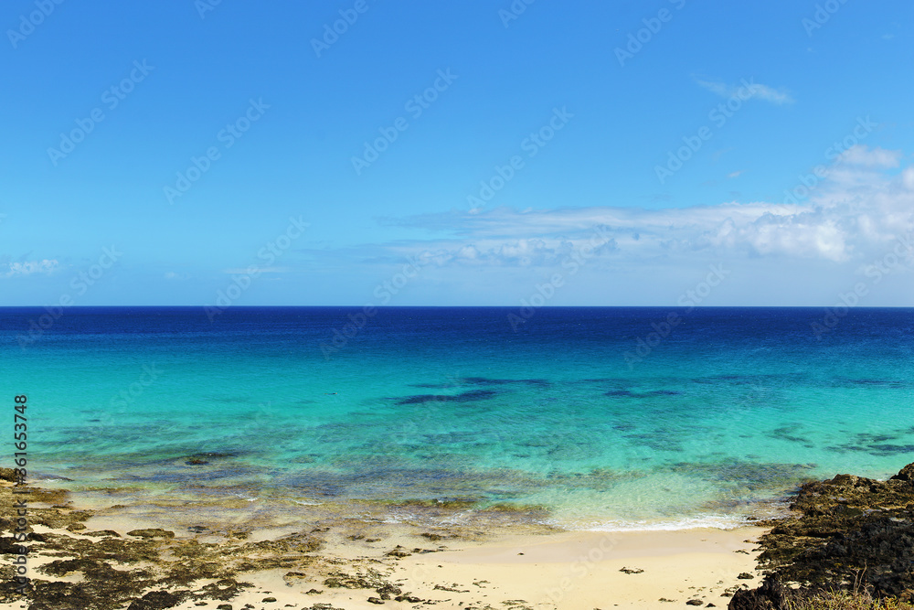 Tropical beach, azure ocean water and blue sky. Paradise landscape. Panorama Tropical beach, azure ocean water and blue sky. Paradise landscape. Panorama