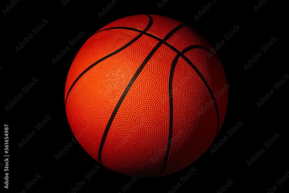Basketball isolated on a black background as a sports and fitness symbol
