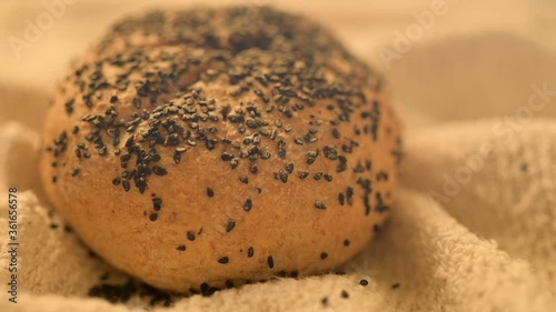 Slow motion video of homemade bread on a rustic background. Fresh Bakery. Bread recently ovened. photo