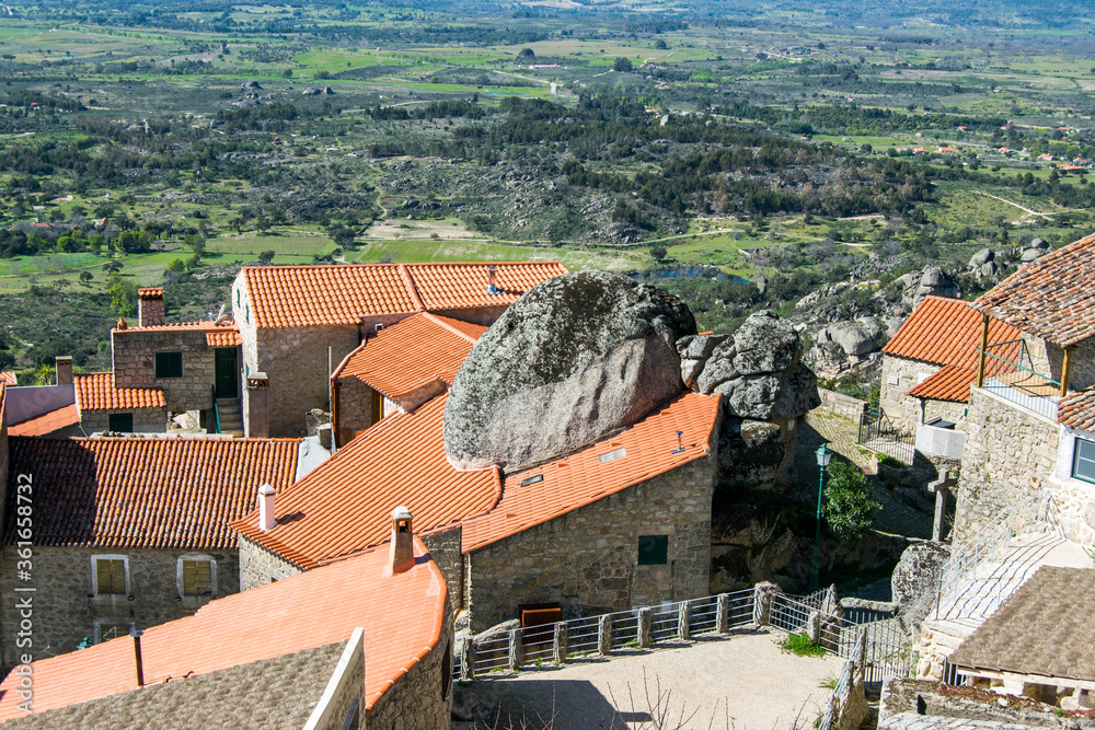 Stone houses between large rocks in the city of Monsanto - Portugal. Monsanto medieval village