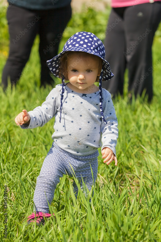 child with hat walking child with hat walking