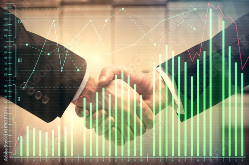 Double exposure of forex graph hologram and handshake of two men. Stock market concept. © peshkova