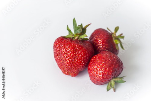 Wallpaper Mural Eco or Bio Strawberry on White Background - Three Berries Composition Isolated Close up View Shot with Natural Light Torontodigital.ca