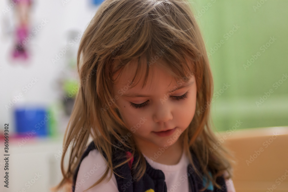 a cute girl playing at home