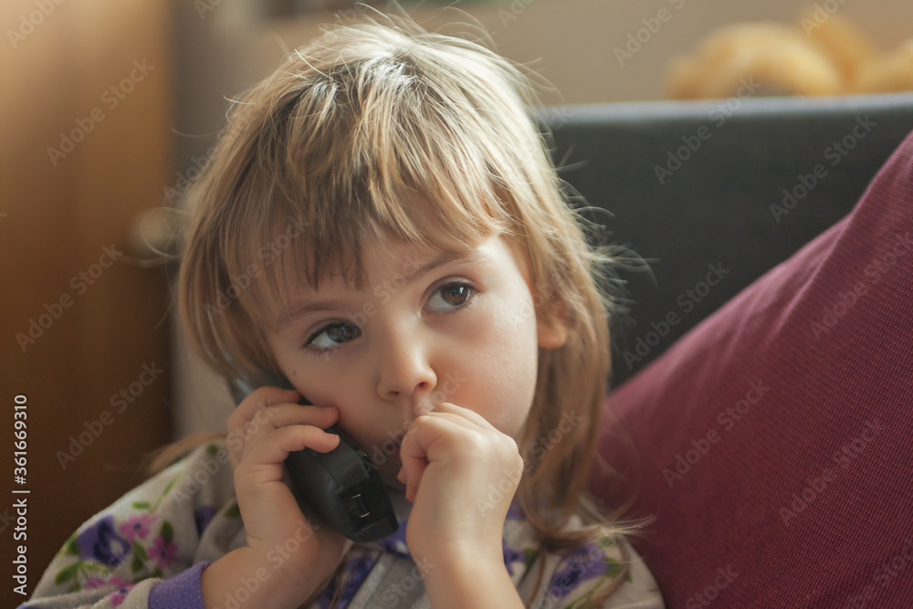 little girl talking on the phone