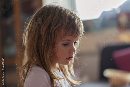 a cute girl playing at home