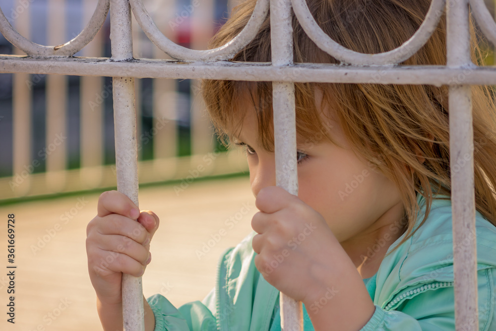child on the fence