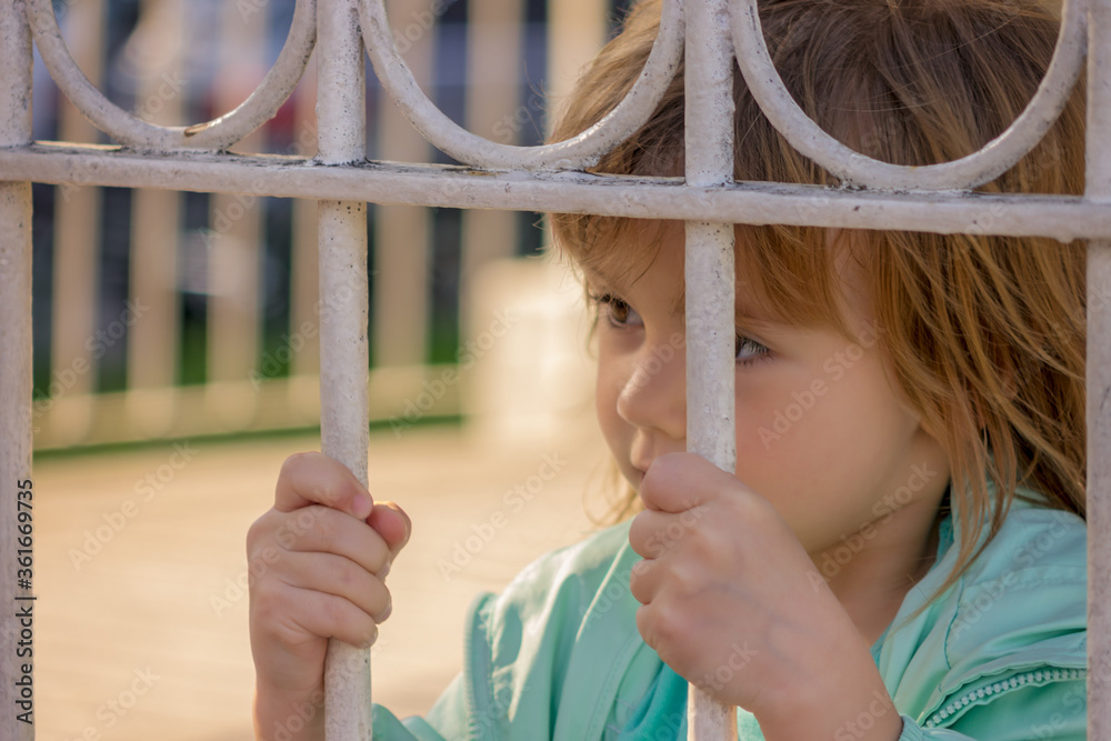 child on the fence