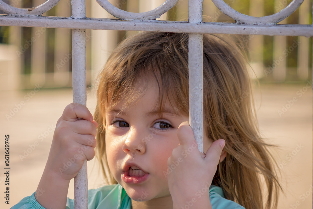child on the fence