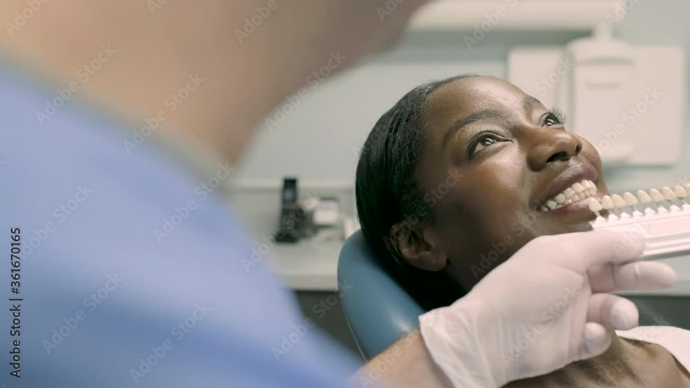Patient getting dental teeth whitening treatment