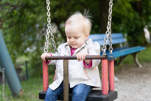 Baby Girl Having Fun on a Swing