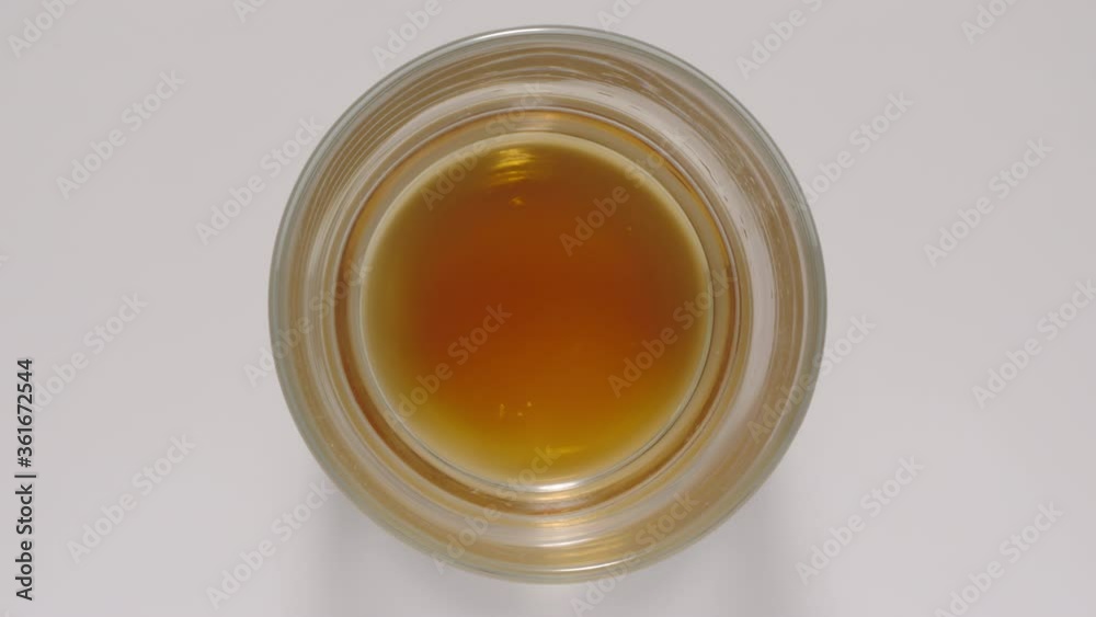 Soda water in a glass is going down to the bottom. TOP VIEW. Stop Motion animation Soda water in a glass is going down to the bottom. TOP VIEW. Stop Motion animation