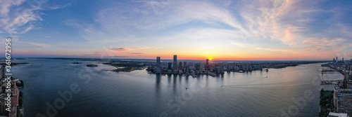 Panorama view of the Skyline of Jersey City in sunset day, New York City, United States. Shot from Hudson River 