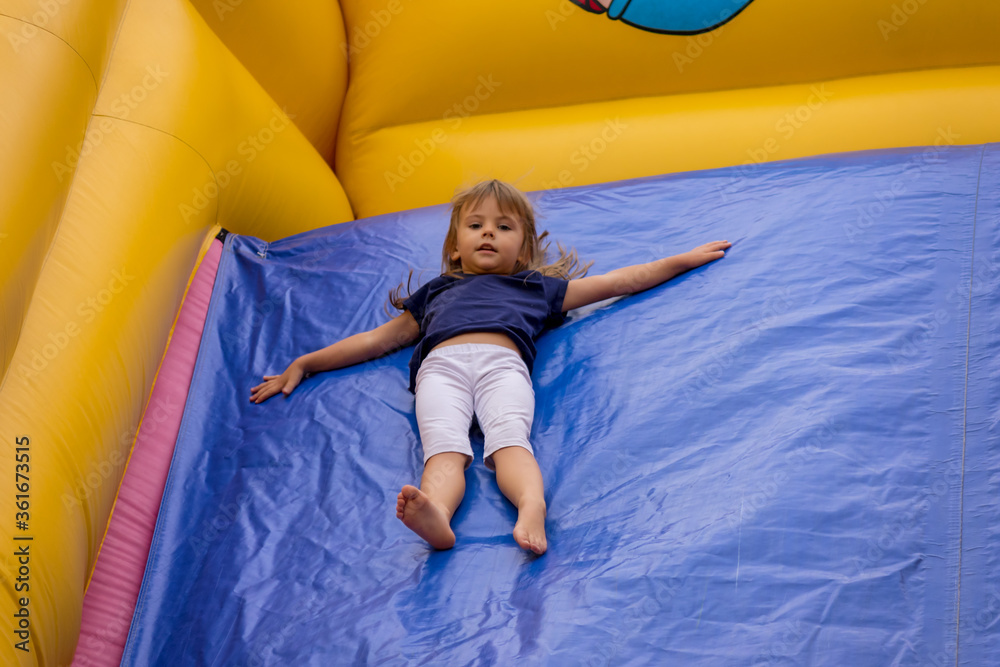 jumping and descending on a rubber slide
