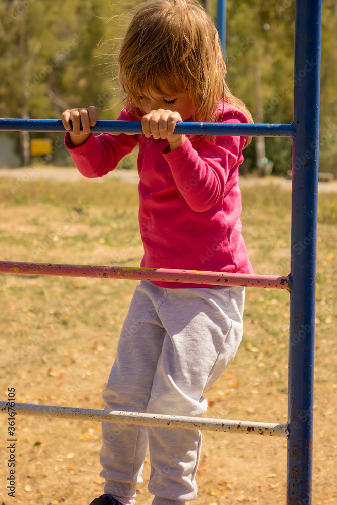 Girl in a park on equipment