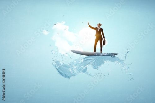 Photography Businesswoman standing on surfing board and making selfie.