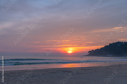 .The sun fell on the horizon in the sea at Karon beach Phuket.