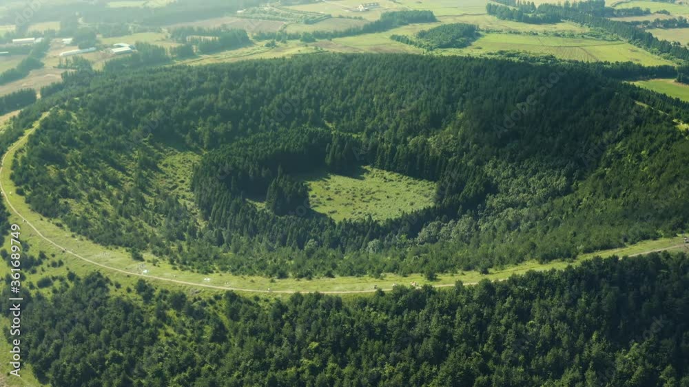 Drone shooting a huge crater that has become a forest. Abu Oreum, Jeju Island.