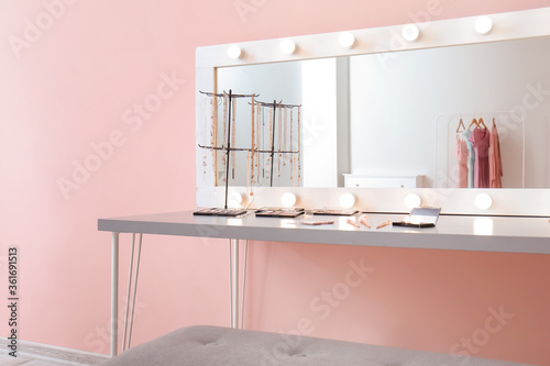 Table with decorative cosme...