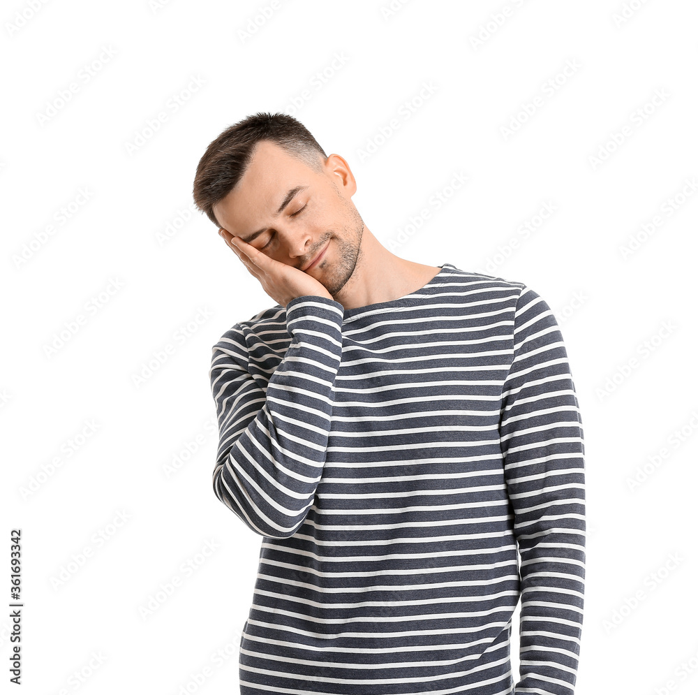 Young man suffering from sleep deprivation on white background Young man suffering from sleep deprivation on white background