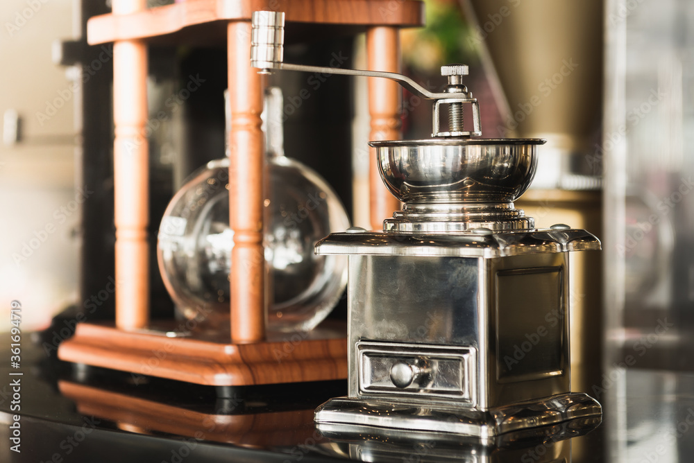 Manual vintage coffee grinder on counter bar