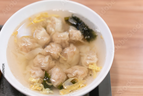 Wonton soup, Chinese traditional food with boiled meat filled wonton and seaweed soup.