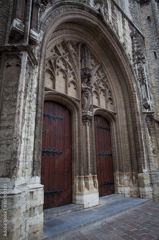 Medieval architecture style of door at St. Bavo's Cathedral in Ghent Belgium