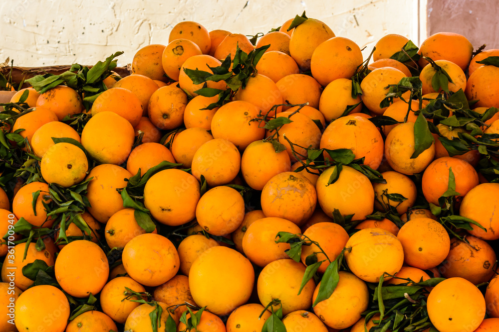Ripe orange fruits for sale on a fruit market