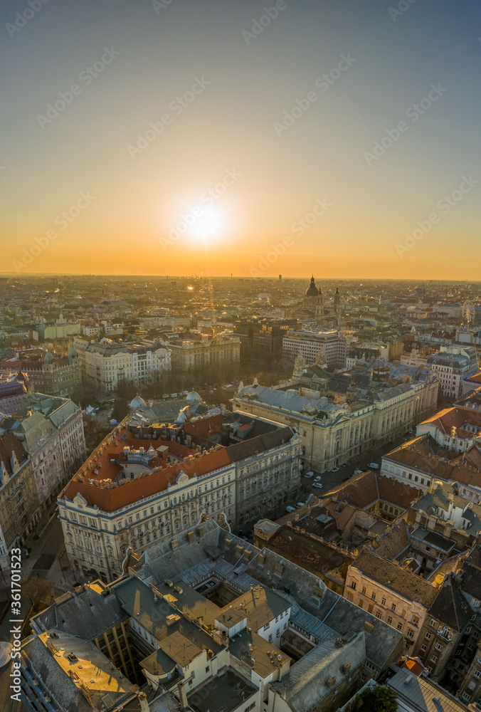 Aerial drone shot of east facade of St. Stephen's Basilica in Budapest sunrise morning glow