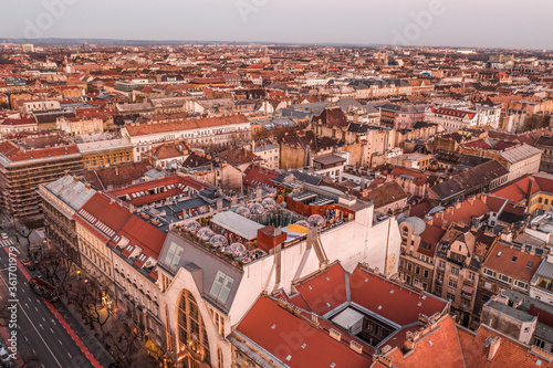 Aerial drone shot of Bubble Bar terrace on rooftop of Budapest building in sunset