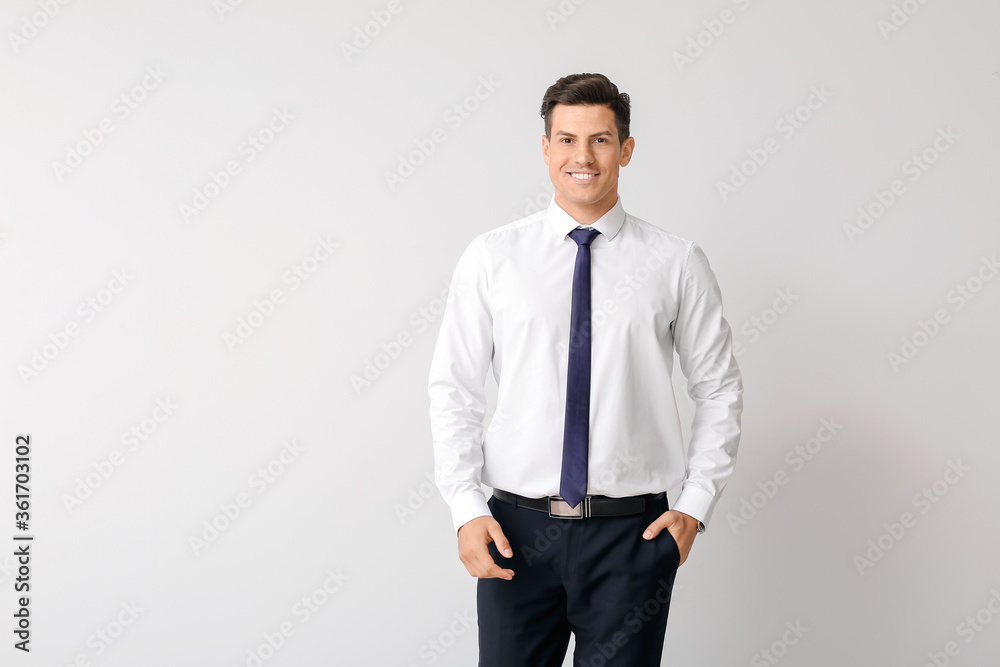Portrait of businessman on light background Portrait of businessman on light background