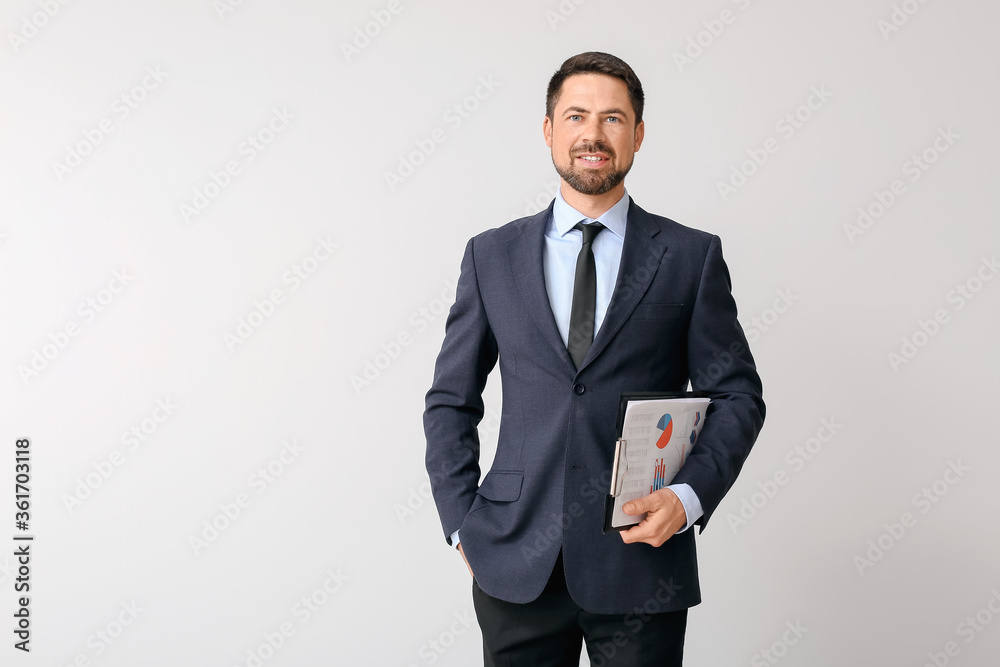 Portrait of businessman on light background Portrait of businessman on light background