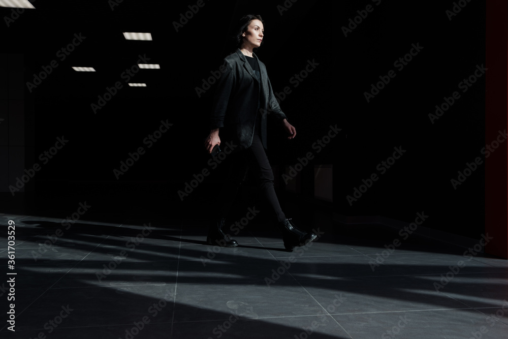 Business Women Style. Woman Going To Work Walking Downstairs. Portrait Of Beautiful Smiling Female In Stylish Office Clothes Going Down Stairs.. Business Women Style. Woman Going To Work Walking Downstairs. Portrait Of Beautiful Smiling Female In Stylish Office Clothes Going Down Stairs..