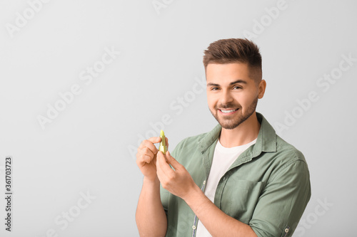 Handsome young man with lip...