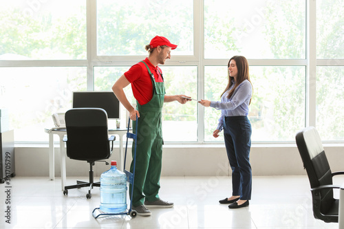 Woman receiving water from ...