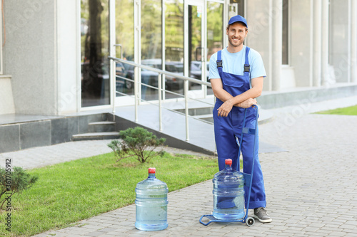 Delivery man with bottles o...