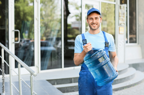 Delivery man with bottle of...