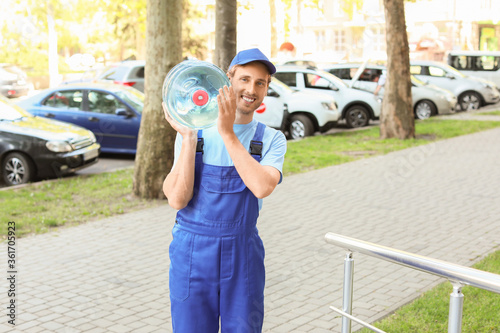 Delivery man with bottle of...
