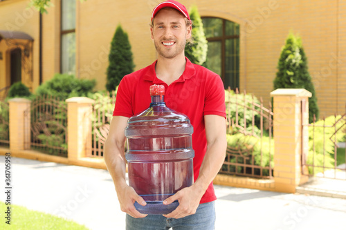 Delivery man with bottle of...
