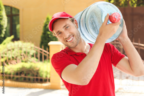 Delivery man with bottle of...