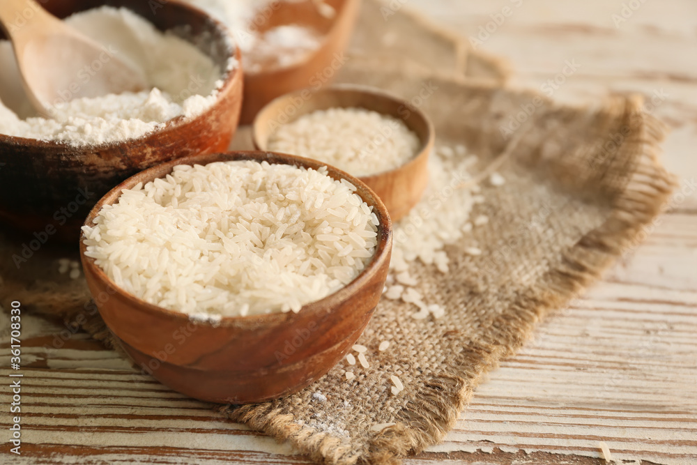Bowl with rice and flour on table Bowl with rice and flour on table