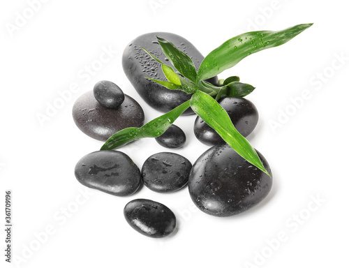 Spa stones and bamboo on white background