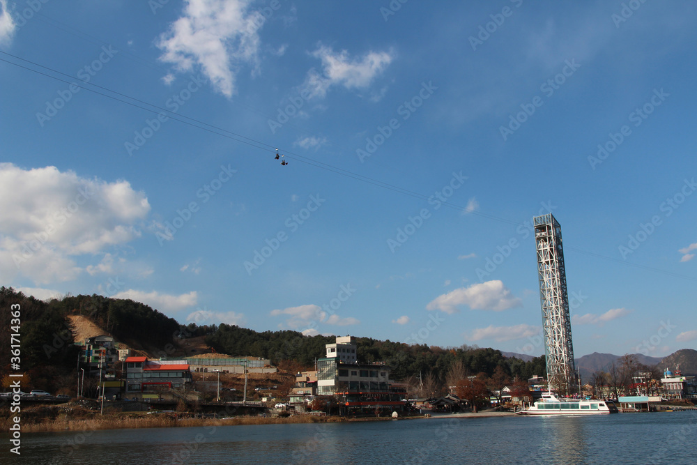 Autumn scenery of Nami Island in sunny day with skyline zip-wire, South Korea